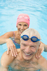 Germany, Senior couple in swimming pool - BABF00273