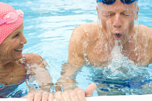 Germany, Senior couple in swimming pool - BABF00272