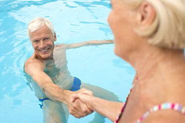 Germany, Senior couple in swimming pool - BABF00267