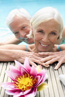 Germany, Senior couple in pool, close-up - BABF00262