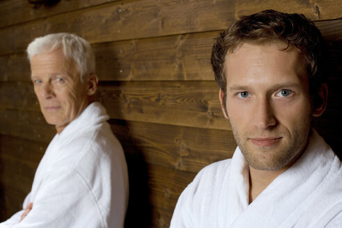 Germany, two men in bathrobe, portrait - BABF00239