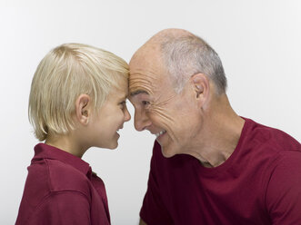 Grandson (8-9) and grandfather, portrait, close-up - WESTF06461