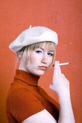 Young woman smoking, portrait - MFF00358