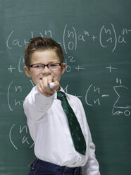 Boy (10-11) in front of blackboard, portrait, close-up - WESTF06390