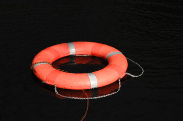 Life preserver floating on water, close-up - CRF01381