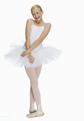 Young ballerina (14-15) smiling, portrait - KMF01156