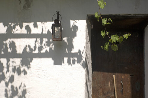 Lantern on house wall, still life - HHF01604