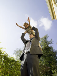 Father holding son (4-5) up on air - WESTF06641