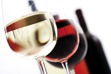 Businesswoman drinking from large wine glass with straw stock