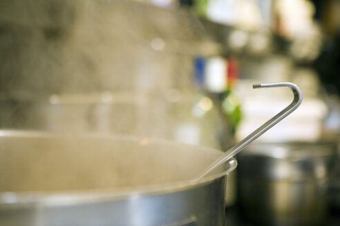 Pot steaming on a kitchen stove - HKF00144