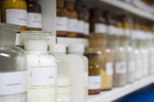 Bottles on shelf in laboratory - HKF00131