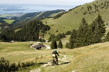 Germany, Bavaria, Chiemsee, Gori Alm, mountainbiker on the way - FFF00871