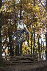 Italy, Southern Tyrol, man mountain biking - FFF00864