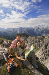 Austria, Salzburger Land, couple on mountain top, portrait - WESTF07555
