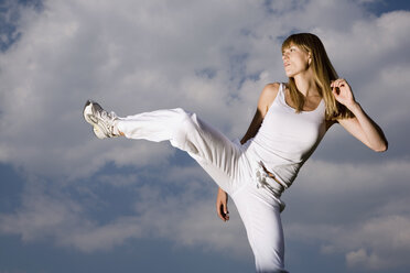 Young woman practicing martial arts - CLF00525