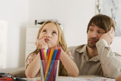 Father and daughter (8-9) doing homework - WESTF07319