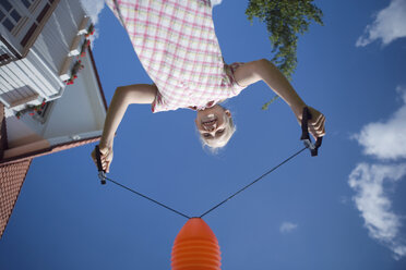 Girl (8-9) playing outside - HKF00161