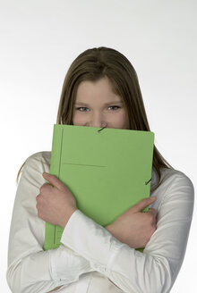Blonde girl (13-14) with folder, portrait - NHF00715