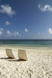 Maledives, Gan, Chairs on beach - GNF00970