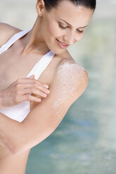 Woman with body scrub on shoulder, portrait - ABF00224