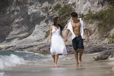 Asia, Thailand, Young couple walking hand in hand along beach - RDF00656