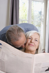Senior man kissing senior woman, portrait - WESTF08203