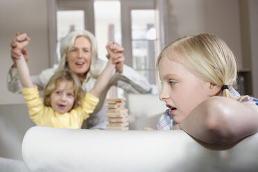 Grandmother playing with grandchildren (8-9), portrait - WESTF08267