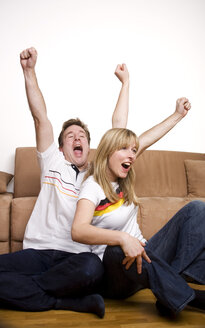 Soccer Fans watching Soccer Game on Television - GAF00033