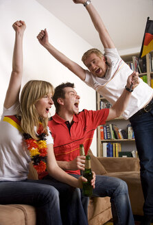 Soccer Fans watching Soccer Game on Television - GAF00018