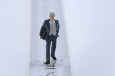 Business man figurine on measuring tape - ASF03671