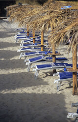 Italy, Sardinia, Deck chairs on Beach - LFF00118