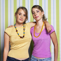Two teenage girls (16-17) embracing, portrait - JLF00289