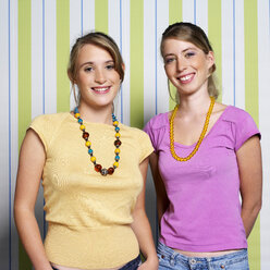 Two teenage girls (16-17) smiling, portrait - JLF00285