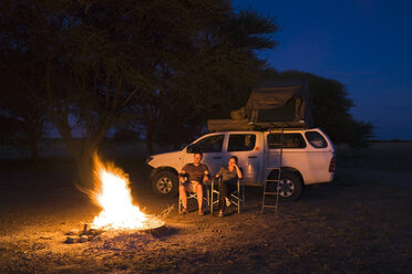 Africa, Botswana, Two persons by camp fire - FOF00733