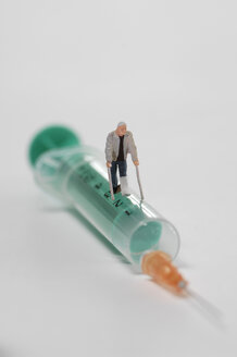 Plastic figurine walking on Syringe - ASF03728