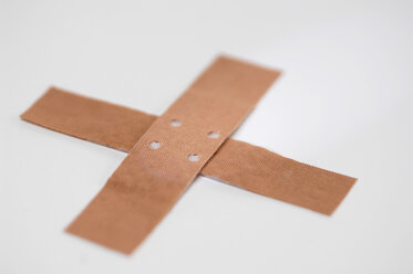 Crossed band-aids, close-up - ASF03724