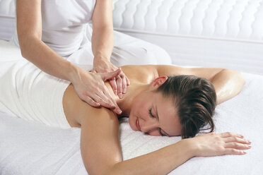 Young woman receiving massage, eyes closed - RDF00910