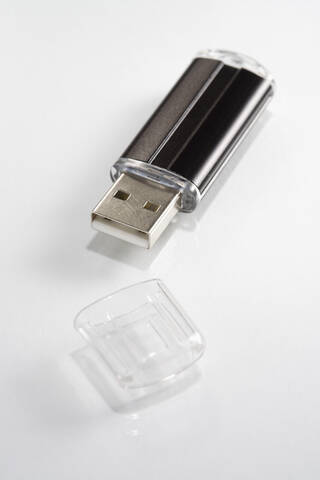 USB flash drive on white background, close-up stock photo