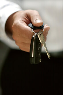 Person holding remote control key, close up - GAF00081