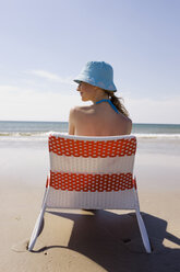 Germany, Baltic sea, Young woman on beach, rear view - WESTF09239