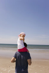 Germany, Baltic sea, Father carrying daughter (6) on shoulders - WESTF09206