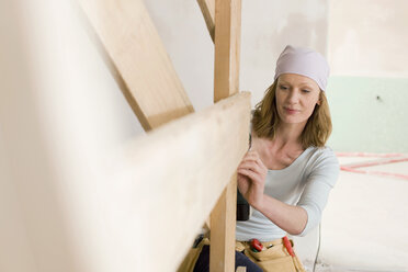 Young woman working at construction site - WESTF09056