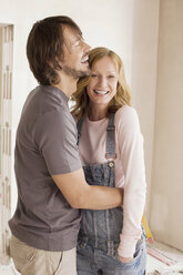 Young couple in an unfinished building, portrait - WESTF09024