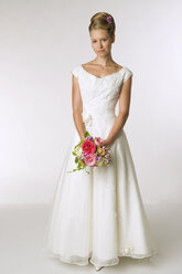 Young bride holding bridal bouquet - NHF00890