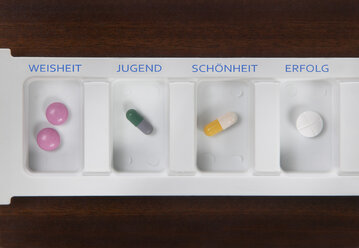 Pills inside pill box, elevated view - THF00931