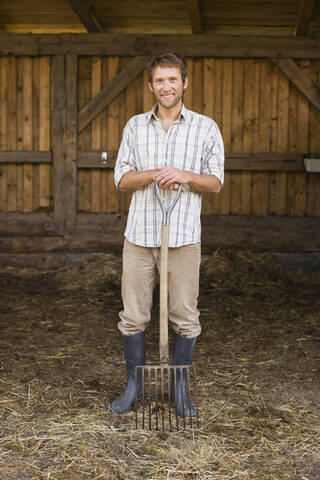 Landwirt mit Heugabel, lizenzfreies Stockfoto