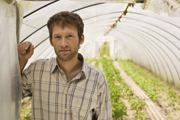 Man in greenhouse, portrait, close-up - BMF00420