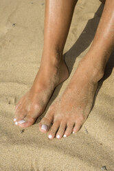 Spain, Lanzarote, Feet on sand, elevated view - UMF00221