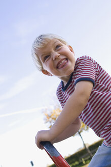 Little boy (4-5) playing on playground - SMO00252