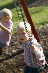 Two little boys ( 2-3) (4-5) sitting on swing - SMO00247